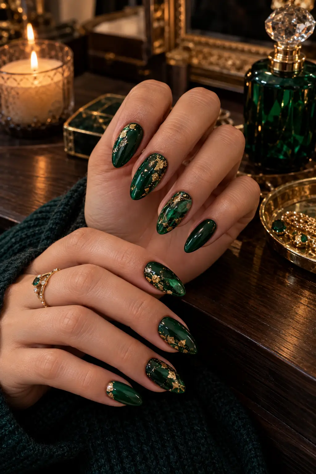 Glossy emerald green nails with gold flakes and a clear bubble accent nail in a witch potion design