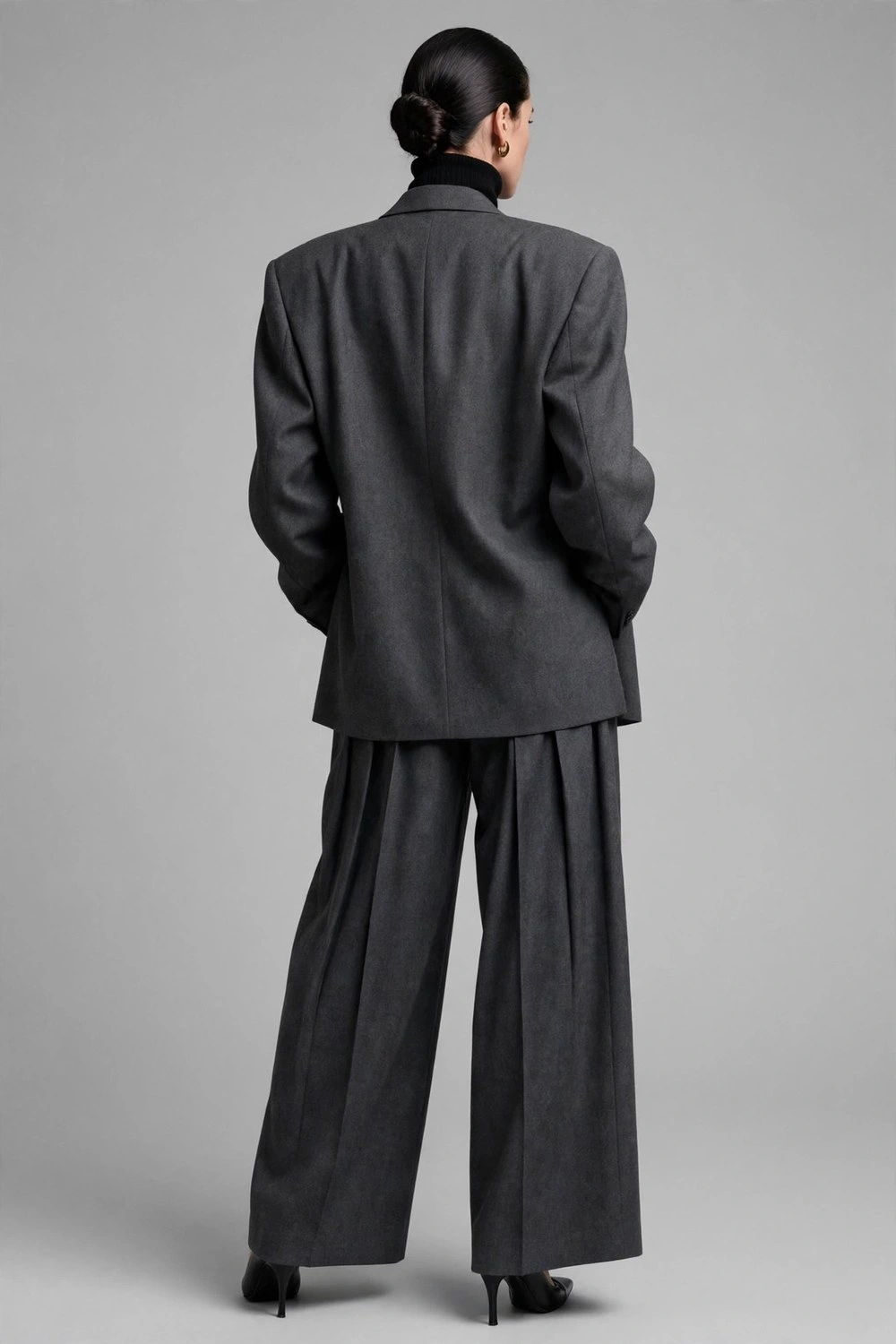 80s luxury outfit with oversized charcoal baggy suit and turtleneck