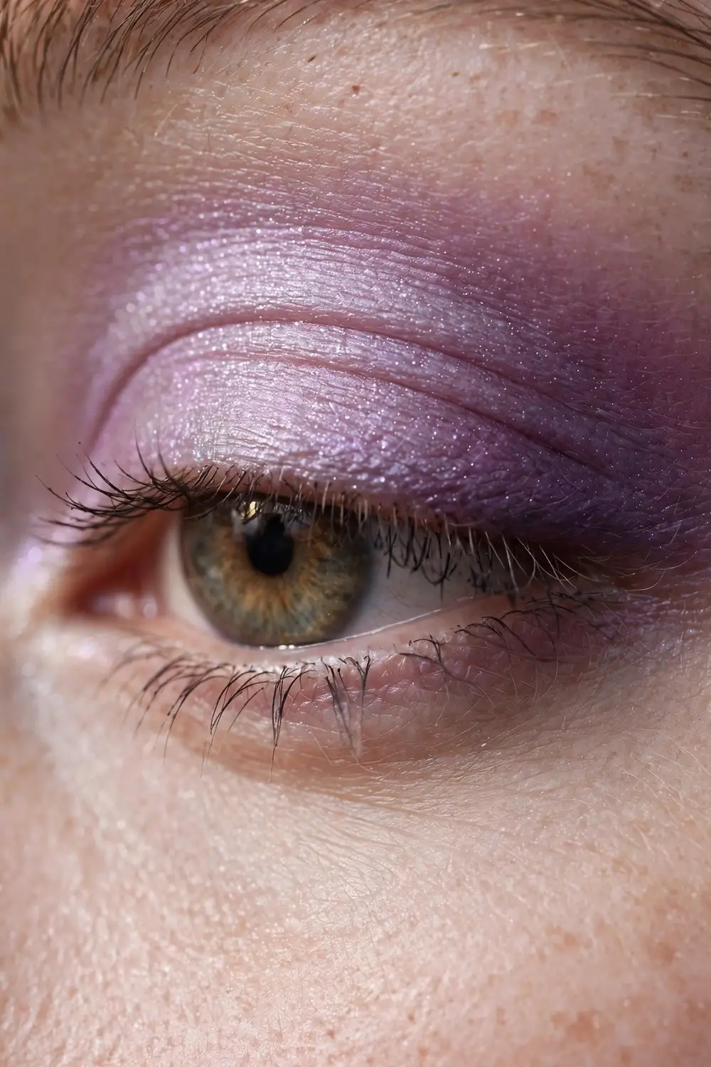 Frosted makeup look with lilac shimmer eyeshadow
