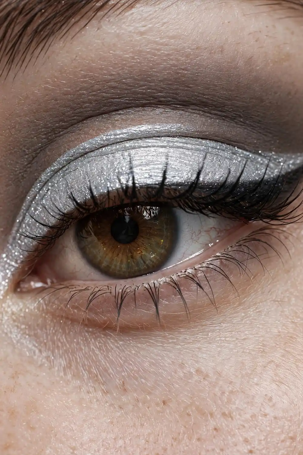 Frosted makeup look with silver cut crease
