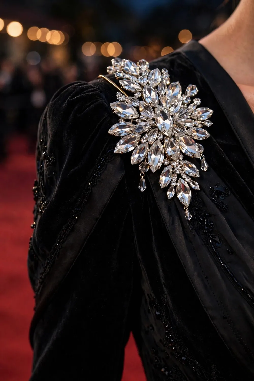 Brooch outfit idea with crystal brooch on evening gown shoulder