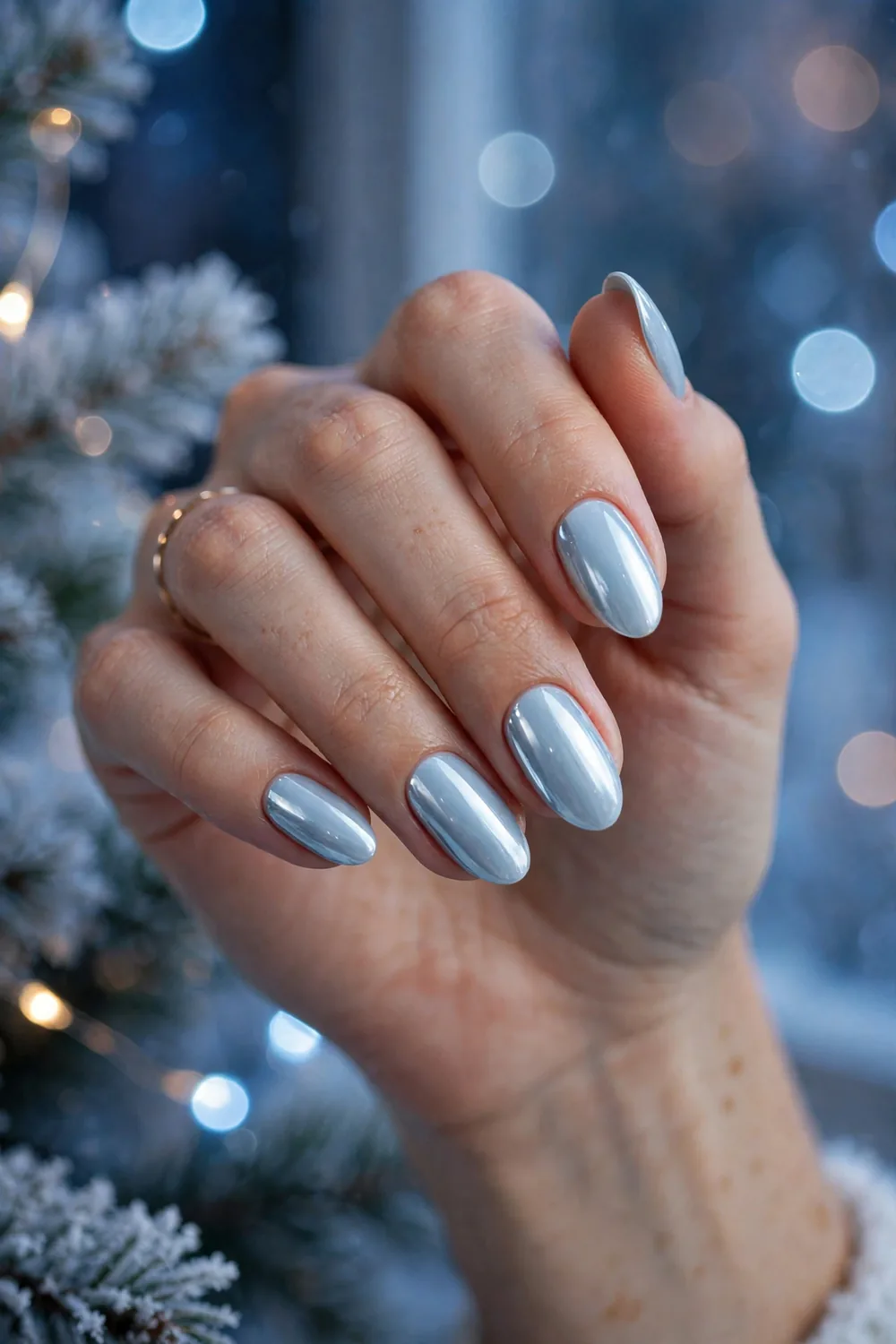 Icy pale blue chrome New Years Eve nails with mirror finish